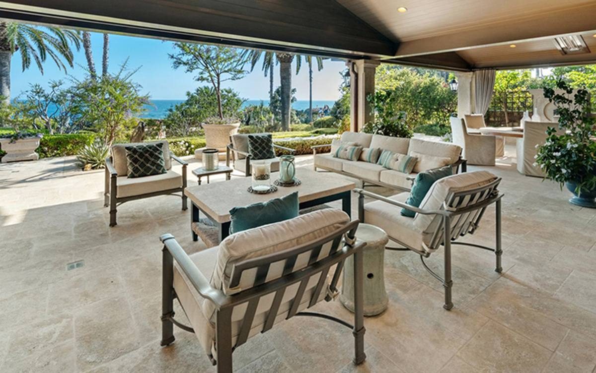 The lanai at 15 Montage Way, with its fireplace, outdoor shower and heaters overlooking the ocean.