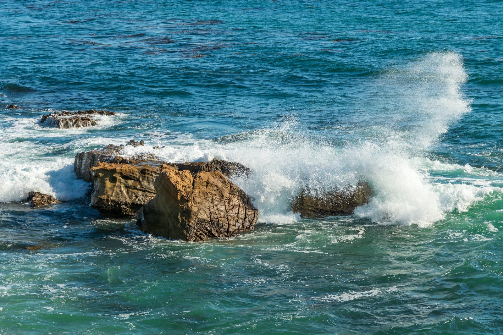 Waves break over the rocks at Heisler Park, a stretch of the rocky Laguna coastline battered by this fall's swells.