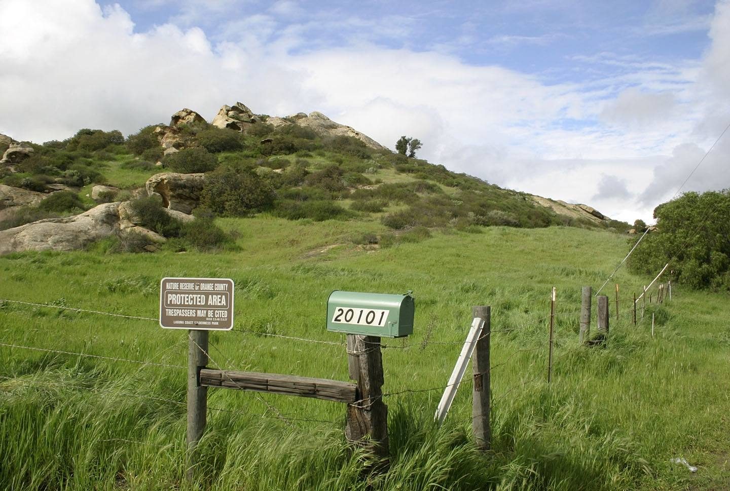 A Nature Reserve of Orange County protected area sign marks the boundary of Laguna Coast Wilderness Park.