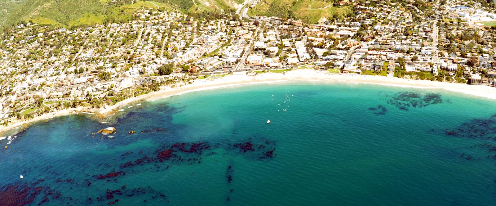 Downtown Laguna Beach and Main Beach from the air, showing the village core where the specific plan update will steer new housing.