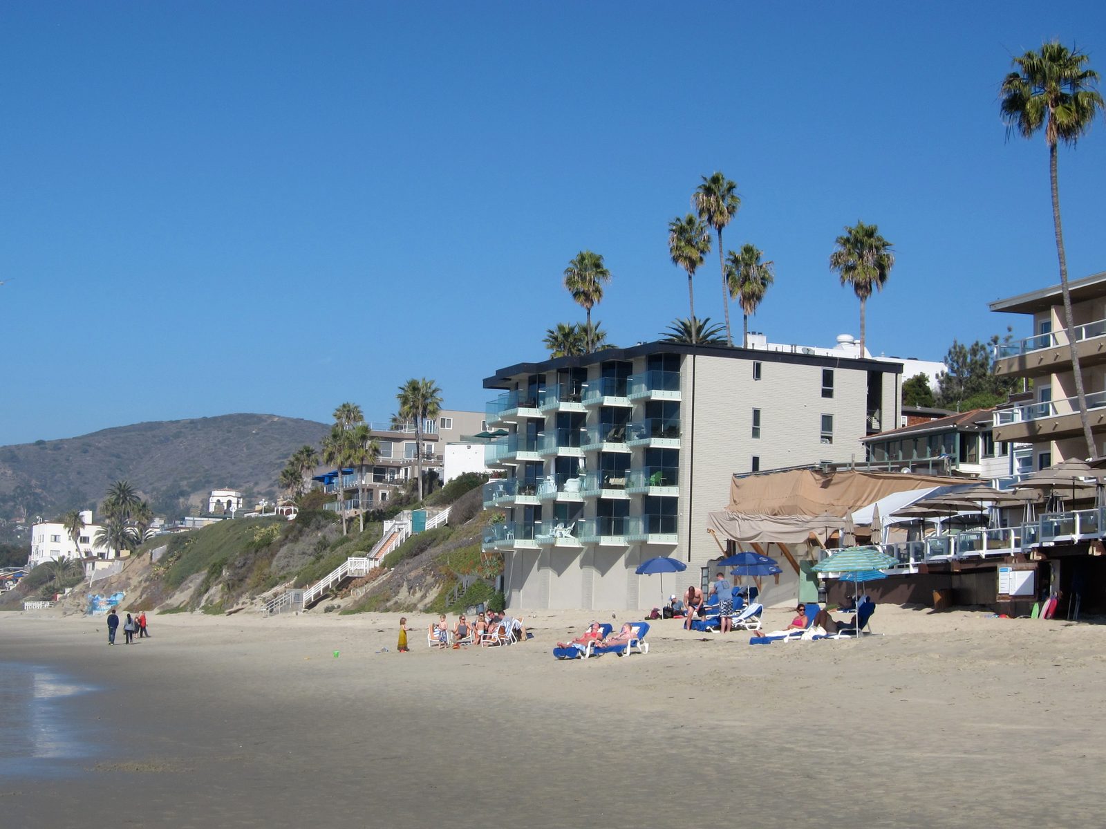 The Pacific Edge Hotel's beachfront building and dining terrace, where Driftwood Kitchen and The Deck served their last guests.