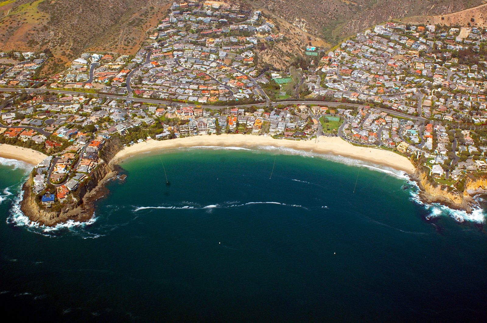Oceanfront homes ring a Laguna Beach cove, in the North Laguna corridor where estate bidding has intensified.