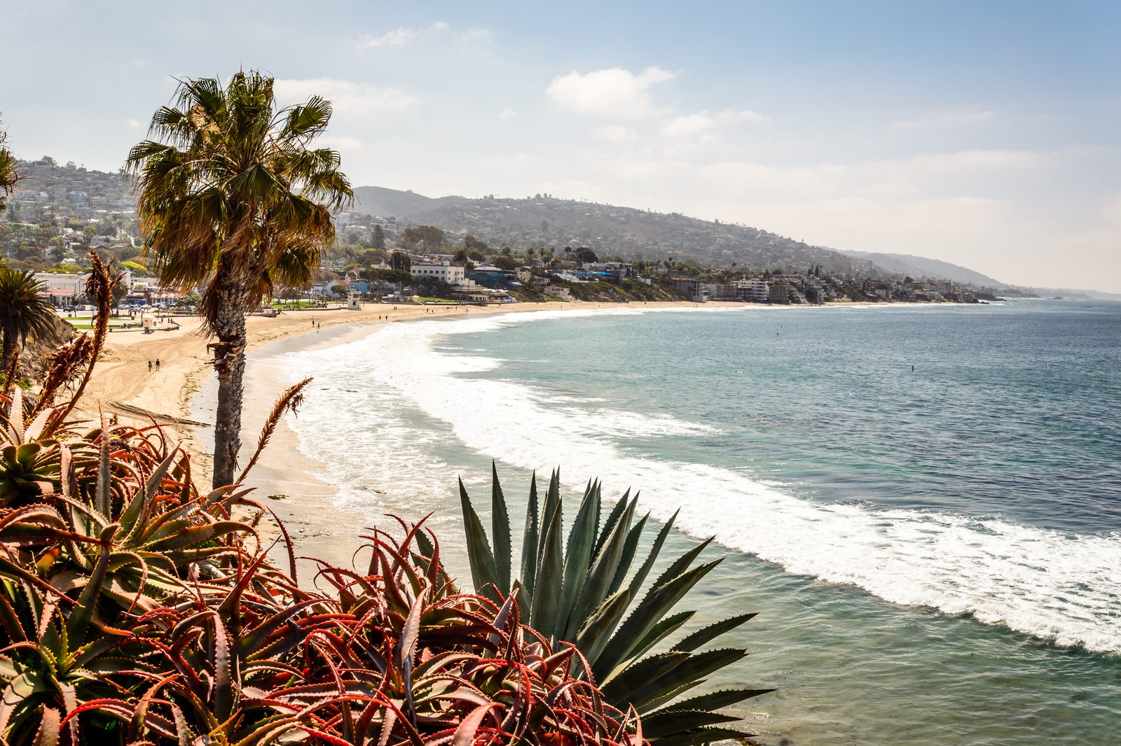 The Laguna Beach coast at Main Beach in daylight. The city says surrounding streets stay open while the crosswalk work finishes.