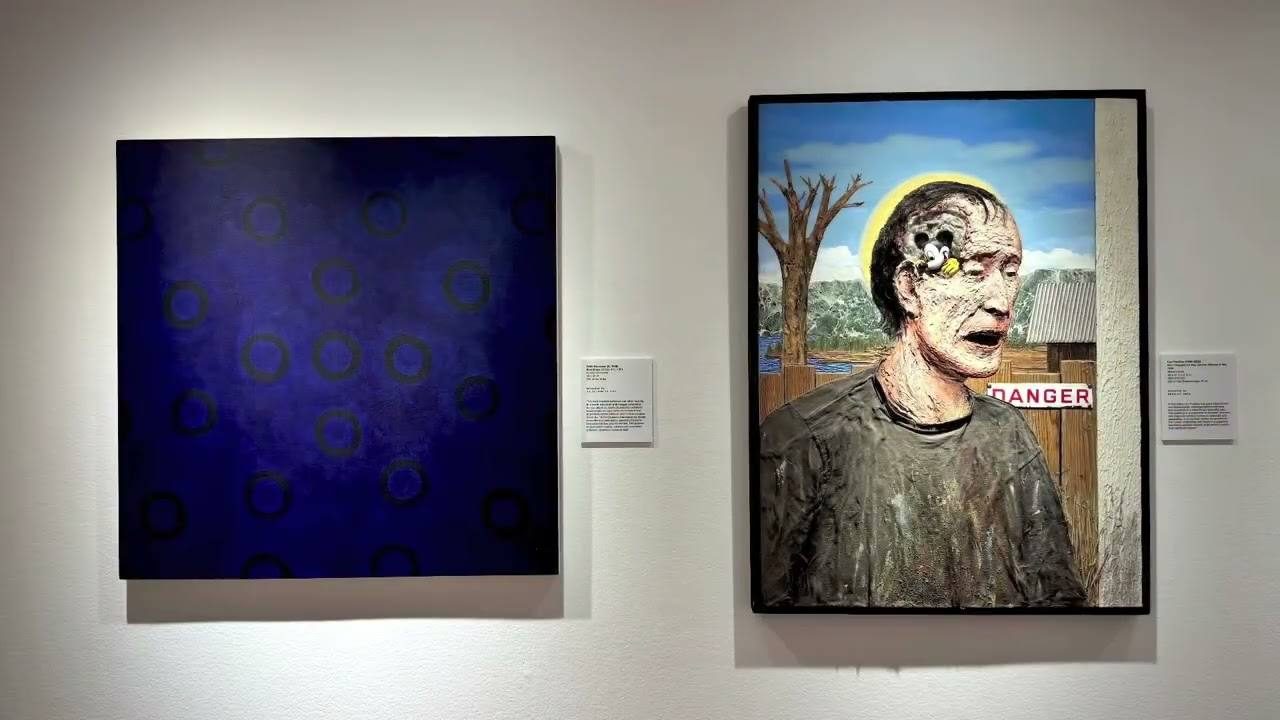 Two paintings hanging in a Laguna Art Museum gallery.