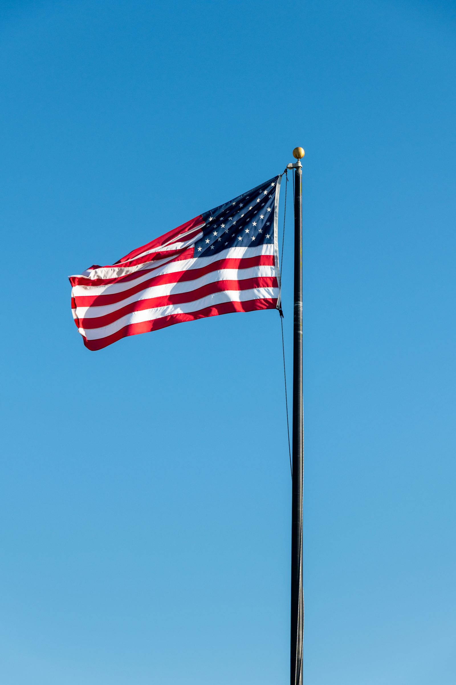 The American flag at Monument Point in Heisler Park above the Pacific.