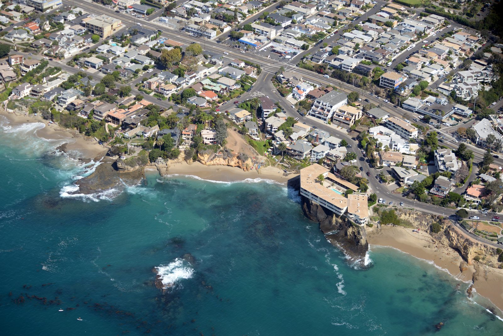 Homes perch on the bluffs of North Laguna, where ember-cast risk runs straight to the sea.