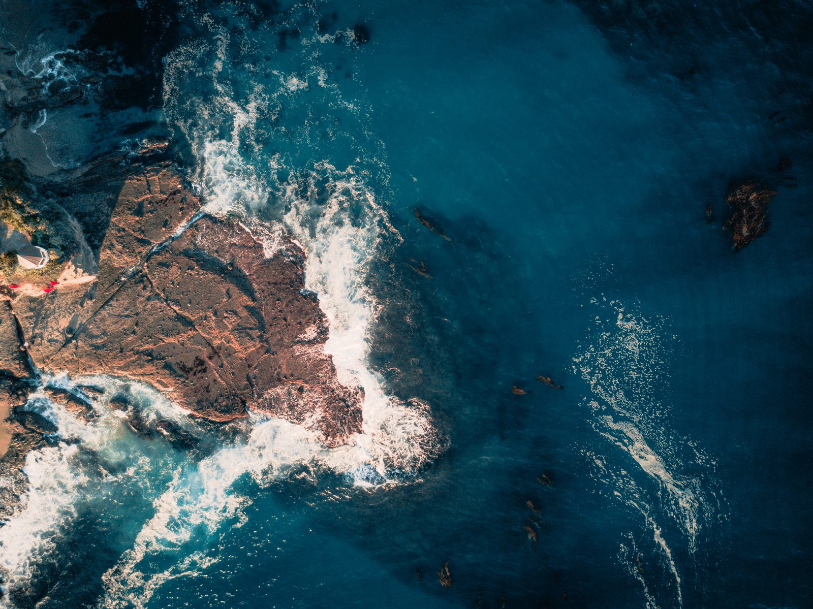 Surf breaks on a rocky point along the Laguna Beach coast. The city's $500 contribution limit applies to direct donations to candidates, not to independent political spending.
