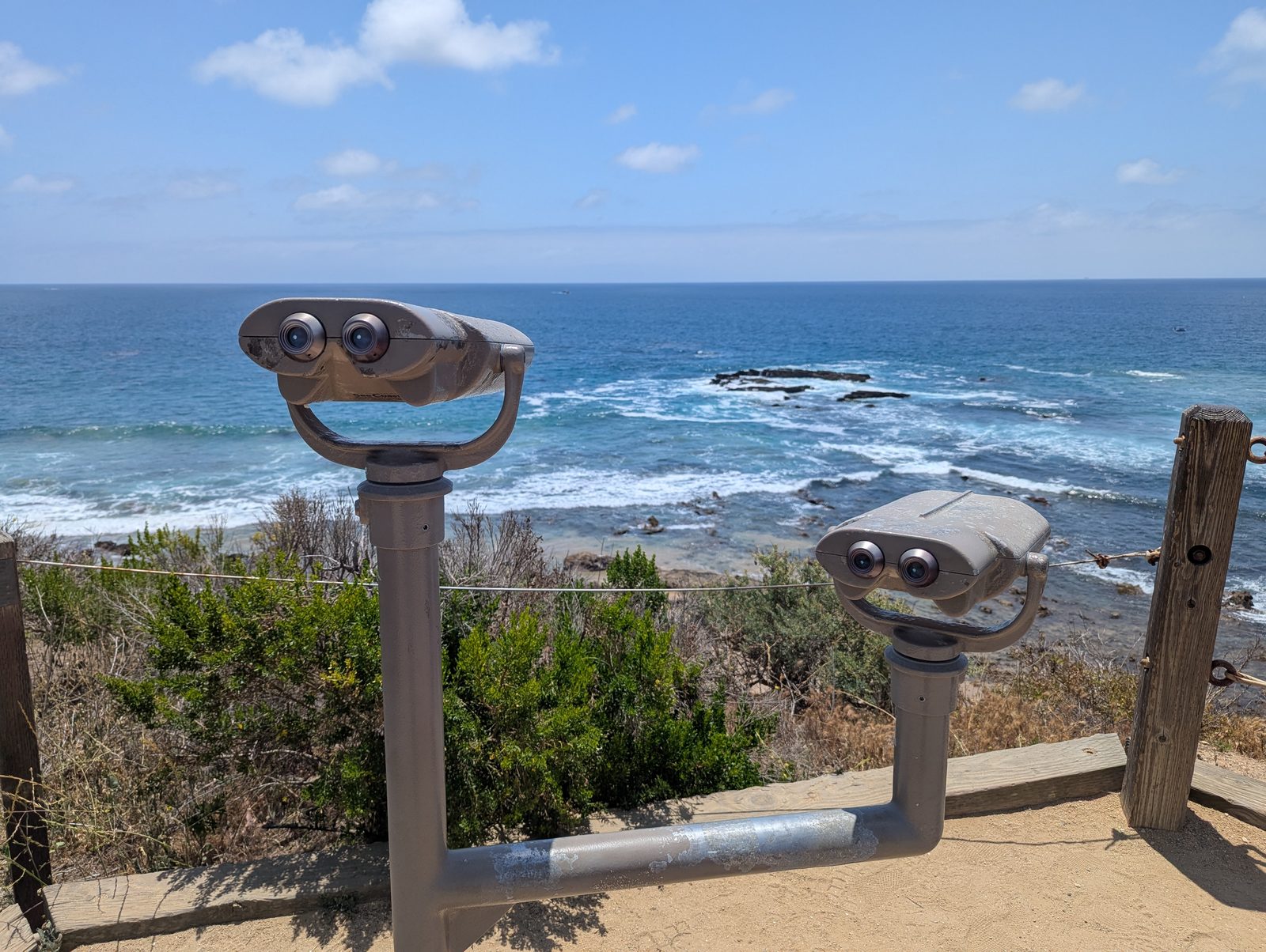 Viewing binoculars on the blufftop at Crystal Cove State Park, above the rocky shore. California State Parks is one of the two agencies whose approval Caltrans awaited on Tuesday for the full southbound closure.