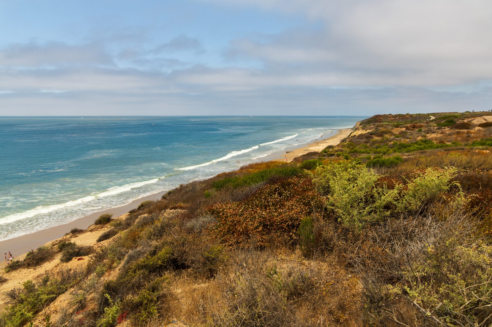 The blufftop at Crystal Cove State Park, above the beach and the coast the highway follows at El Morro. The right southbound lane of Pacific Coast Highway remains closed between Irvine Cove Drive and Reef Point Drive.