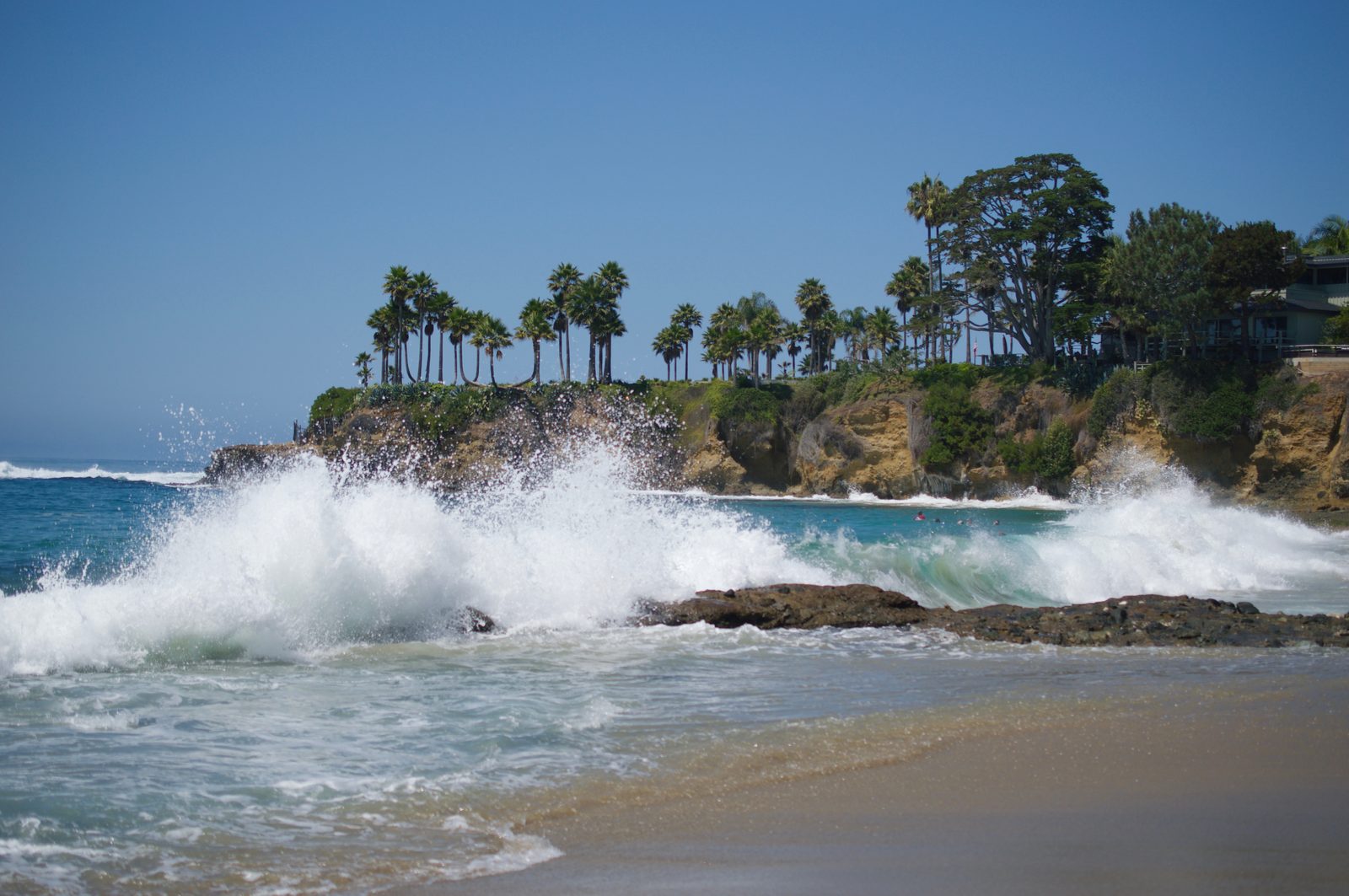 Waves break against the rocks at a Laguna Beach cove. Surfer.com reported new footage of a roughly 25-foot backwash wall exploding at the shoreline in Laguna Beach.