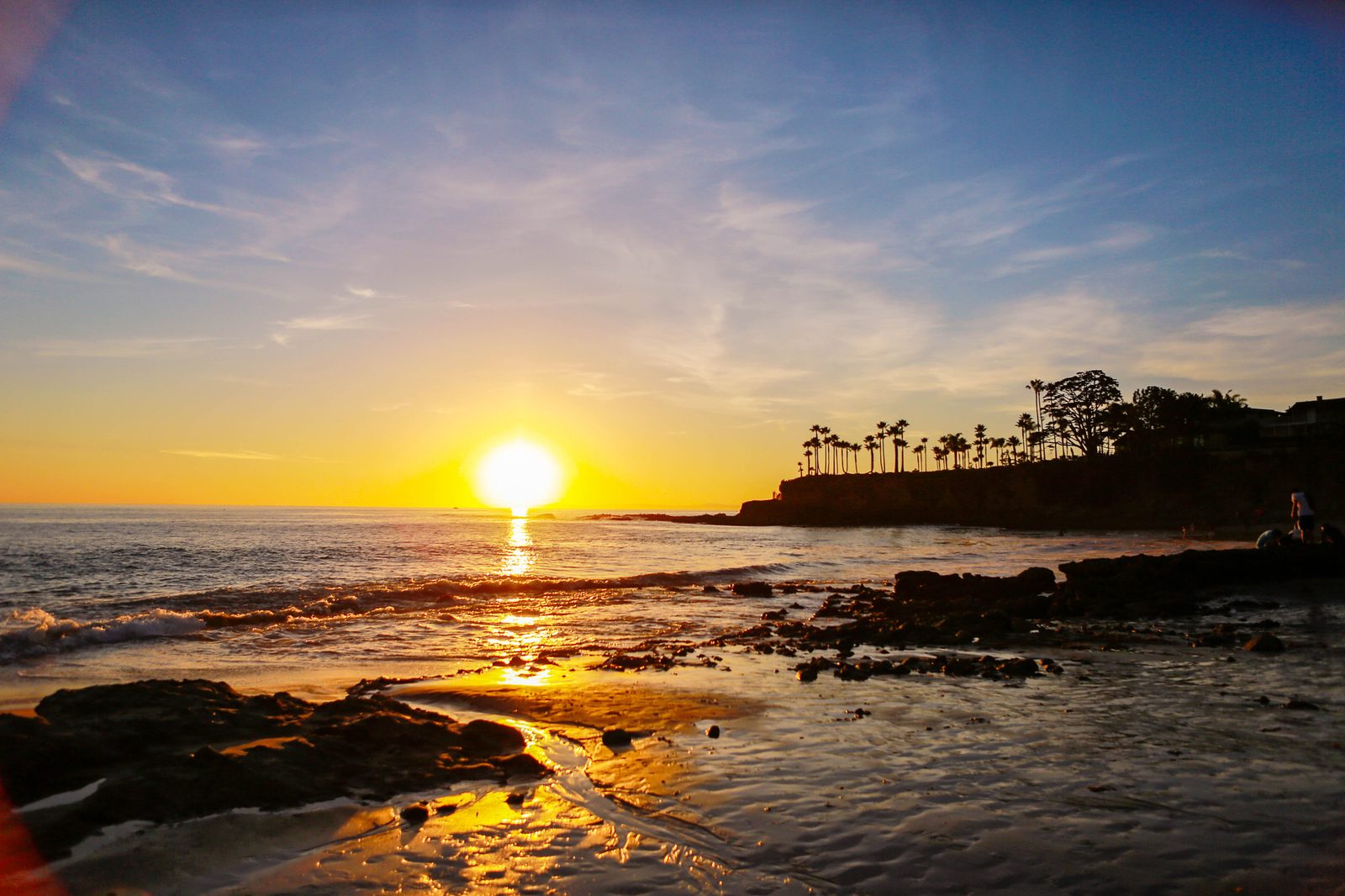 Sunset at Shaw's Cove in Laguna Beach. Forecasters say the coastal flood threat continues into Tuesday as Rachel's energy lingers off the coast.