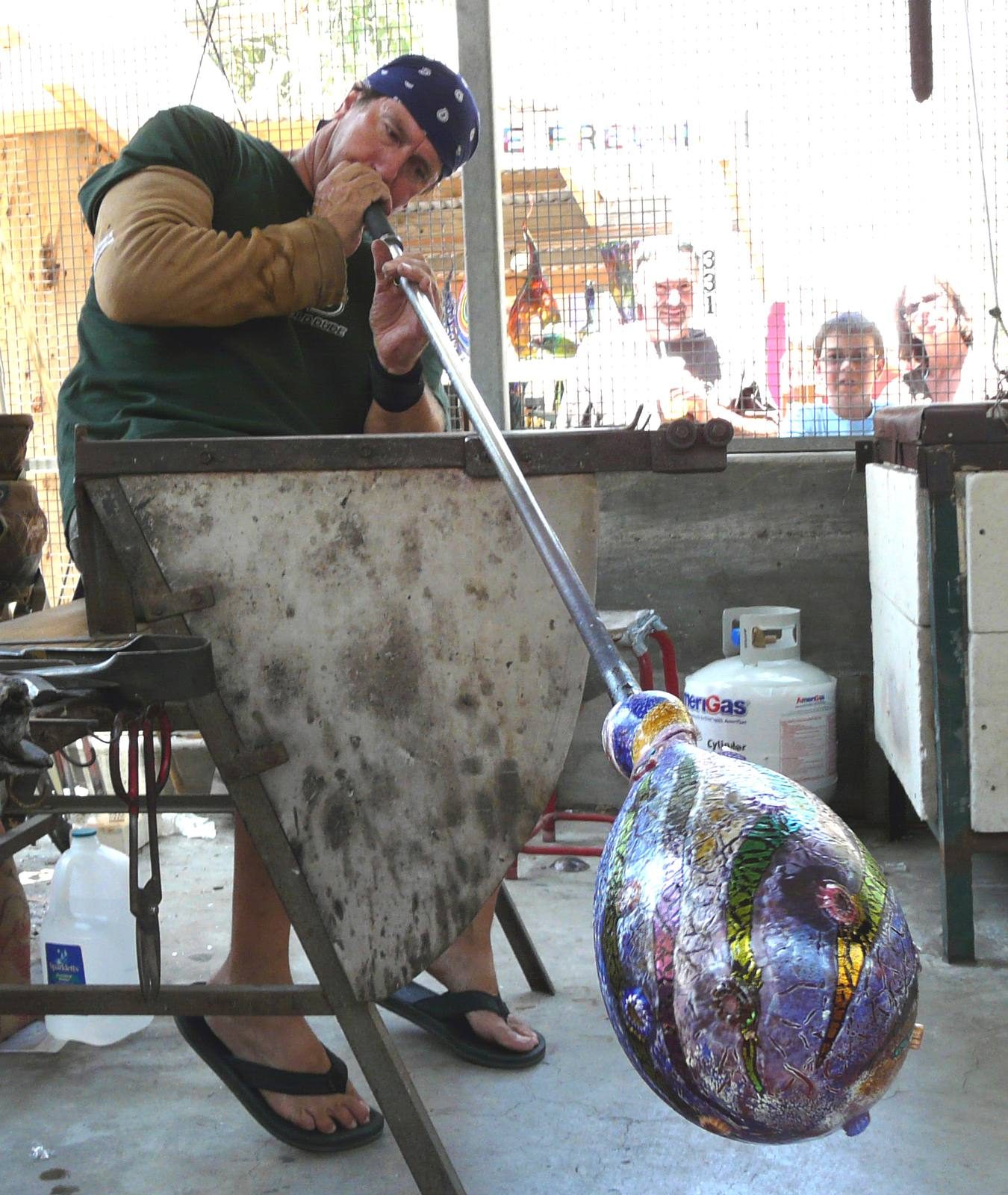A glassblower at work at the Sawdust Art Festival.