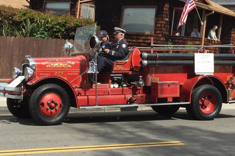 Laguna Beach's 1931 Seagrave fire engine, the first fire apparatus the city ever purchased, rolls in a parade. The council voted Tuesday to dedicate the engine to retired Capt. Eugene D'Isabella.
