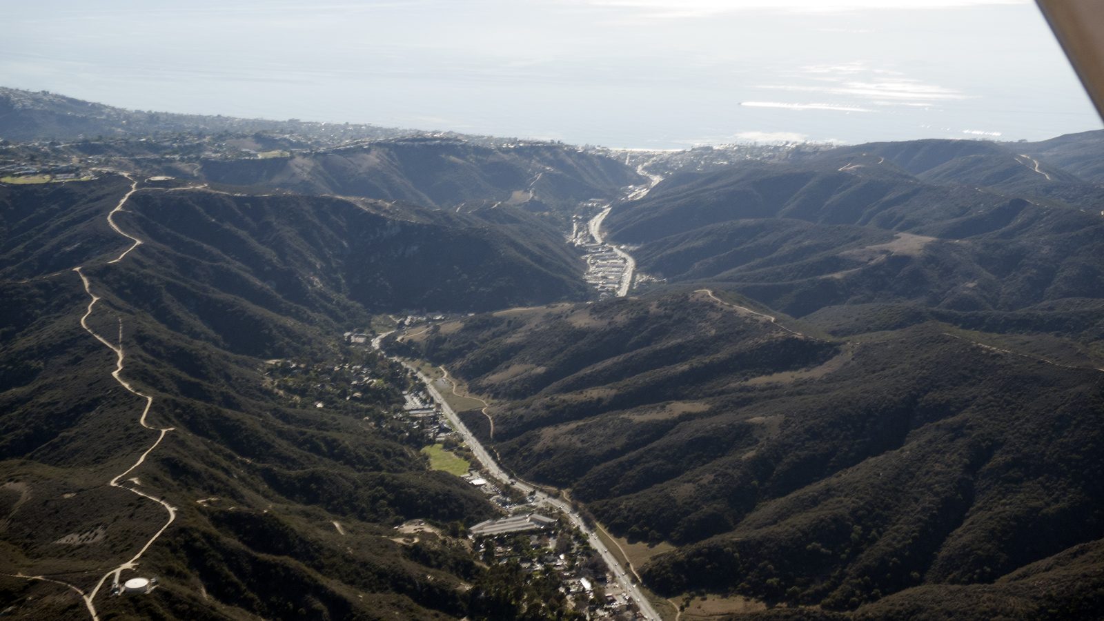 Laguna Canyon Road threads the canyon toward the coast, the evacuation corridor at the heart of the wildfire plan.